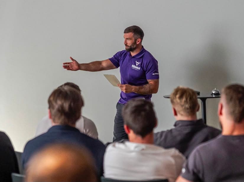 Michael Gentilli presenting to a seated room of coaches
