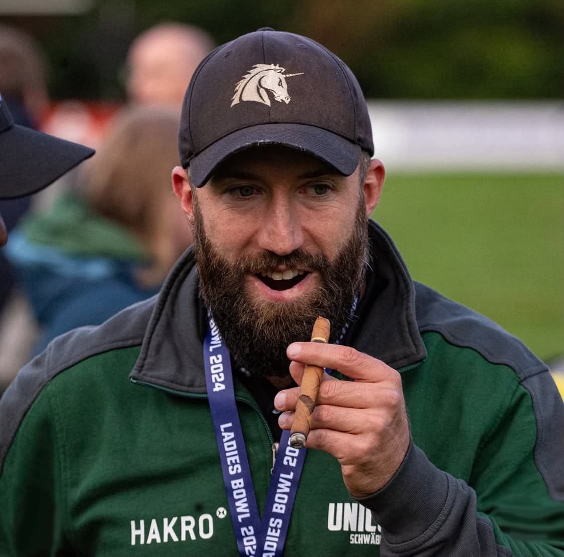 Michael Gentilli with a cigar after the Ladies Bowl, championship lanyard around his neck