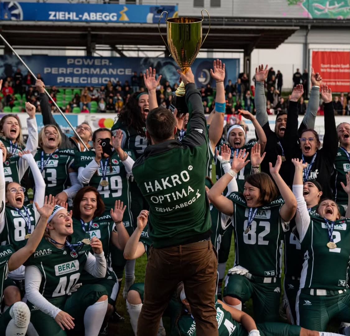 Michael Gentilli lifting the championship cup in front of his squad